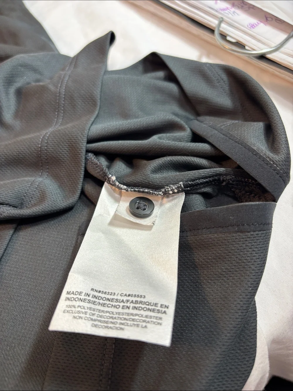 Jordan Black Charlotte Hornets Polo with White Jumpman. 0189